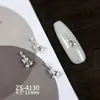 Novos designs de nail art com adornos de zircônia cúbica de alta qualidade, leves e luxuosos, incluindo strass nas pontas dos dedos estilo francês, decorações de unha versáteis e deslumbrantes, e motivos de coração e borboleta