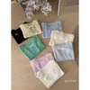 Suéter de Punto Fino Falso de Dos Piezas de Seda de Hielo de Manga Corta para Mujer 2025 Nuevo Verano Sentido del Diseño Moda Estilo Occidental Top Calado