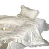 Nuevo juego de ropa de cama de cuatro piezas jacquard de algodón Tencel estilo francés, con sábanas de seda helada, una funda de edredón y ropa de cama con volantes para un sueño confortable