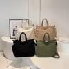 Bolsa de tela bolsa de mano de gran capacidad femenina 2023 nuevo otoño e invierno casual versátil bolsa de hombro estudiante clase bolsa grande
