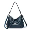 Bolso tote versátil de diseño retro de nicho transfronterizo para mujer 2026 nuevo alta apariencia lujo ligero para ir al trabajo bolso de un solo hombro cruzado