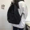 Mochila escolar de lona retrô para estudantes estilo ins feminina mochila versátil para estudantes do ensino médio feminino cor sólida simples mochila de campus masculina