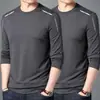 Camiseta fina de manga larga para hombre para otoño, color liso, elástica, secado rápido, corte holgado, cuello redondo casual moderno, camiseta interior