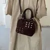 Bolso bandolera minimalista de otoño nuevo 2026 de nicho de lujo retro con remaches para mujer