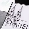 ¡Guau!Moda Transfronteriza Europea y Americana, Varios Pendientes Largos Metálicos de Borla Exagerada de Estilo Moderno con Elementos Elegantes