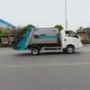 Vehículo de saneamiento totalmente eléctrico con compactador de basura sellado, diseñado para la compresión automática de residuos sólidos municipales para su recolección y transporte
