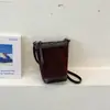 Bolso de mano retro de gamuza para mujer para otoño e invierno, nuevo bolso tipo cubo elegante y versátil 2026, bolso cruzado casual de nicho para el día a día