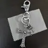 Nueva colección de llaveros elegantes y únicos con doble colgante en forma de cruz, ancla, corazón, espada y broche de langosta