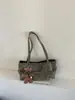 Outono/Inverno 2026 Novo Estilo Coreano Retrô Nicho Cadarço Ombro Único Bolsa de Axila Feminina Versátil Bolsa de Mão para o Dia a Dia Bolsa Tote