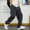 Pantalones casuales rectos a rayas de estilo coreano chic para primavera y otoño para hombre, estilo Harajuku, holgados, de pierna ancha, largos, para hombre y mujer.