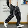 Pantalones casuales rectos a rayas de estilo coreano chic para primavera y otoño para hombre, estilo Harajuku, holgados, de pierna ancha, largos, para hombre y mujer.