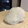 Nuevo Sombrero de Color Sólido Estilo Japonés Retro Adelante Primavera y Verano 2026 Estilo Femenino Boina Adelgazante para la Cara Sombrero Versátil de Moda Casual para Hombres