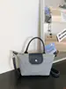 Bolsa Mini Dumpling Patchwork em Jeans para Mulheres 2026 Novo Estilo Coreano Bolsa Tote de Nicho com Acabamento de Alta Qualidade, Pode Ser Usada no Ombro, Transversal ou como Bolsa de Mão