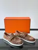 Zapatos casuales exclusivos de cuero genuino transfronterizos, mocasines de piel de vaca con patrón de lichi y hebilla metálica