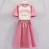 Falda de traje casual para niñas ropa infantil verano nuevo estilo occidental para niños top de manga corta con letras falda de dos piezas delgada