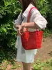 2026 Verano Hecho a Mano Estilo Coreano Piel Suave Tejido Cesta Hueca Bolso de Mano de Moda para Vacaciones Bolso de Hombro Bolso Tote para debajo del brazo