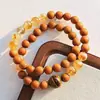 Pulsera con Diseño Multicírculo de Sándalo Natural, Cristal Amarillo y Ojo de Tigre