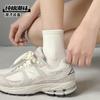 Calcetines blancos y negros mujer otoño e invierno algodón altos banda de goma calcetines de tubo mujer color sólido tendencia ins ocio calcetines deportivos al por mayor