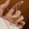 Loja de ouro com corrente de colar de trigo com zircônia incrustada de ouro falso, corrente de clavícula com pingente de círculo de moda feminina