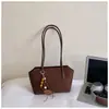 Bolso de hombro retro simple casual estilo coreano para mujer, nuevo modelo 2026, texturizado y único, de gran capacidad para el día a día, moderno