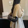 Bolso de diseño de nicho retro de alta gama para mujer 2026 nuevo popular versátil de un solo hombro para debajo del brazo bolso de albóndiga de otoño