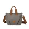 Bolsa de ombro feminina estilo 2026, moderna, versátil, simples e elegante, inspirada no estilo coreano. Bolsa de lona portátil com grande capacidade.