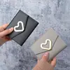 Bolsa para monedas versátil de dropshipping, monedero clutch tarjetero con forma de corazón personalizado de moda 2026, venta al por mayor transfronteriza