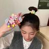 Corea del Sur dulce flor niños cuerda de pelo anillo de pelo niña cola de caballo bola cabeza goma banda de pelo cuerda accesorios para el cabello al por mayor