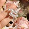 Anillo de Dedo Abierto con Diamantes Incrustados Perla Camelia Blanco Nieve Delicado Brillante Serpentino Viento Frío de Nicho Femenino
