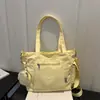 Nova bolsa de tecido de cor sólida transfronteiriça 2026 início do outono elegante grande capacidade alto valor texturizada versátil bolsa de ombro transversal