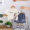 Novo Conjunto de Verão Infantil Cartoon de Manga Curta para Meninos e Meninas, Conjunto Elegante de Duas Peças, Casual e Moderno, Fresco para Bebês no Verão