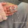 Pendientes de Nuevo Estilo 2026 para Mujer, Pendientes Largos y de Lujo con Lunas de Pedrería, Temperamento de Lujo Ligero, Pendientes Populares de Borlas de Nicho