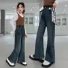 Calça jeans feminina primavera/outono 2026 novo estilo roupas infantis grandes primavera moda coreana calça boca de sino estilosa cross-border