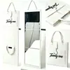 Espejo de cuerpo entero portátil de fieltro al por mayor, espejo de tocador plegable de pared, espejo de mano para guardar, adecuado para dormitorios y uso doméstico, personalizable