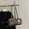 Bolso de axila de leopardo de alta gama para mujer, versátil para ir al trabajo, bolso de hombro moderno y minimalista con colgante, transfronterizo