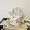 Bolso de mano Hello Kitty para mujer 2026 nuevo bolso tipo cubo de dibujos animados con un toque de alta gama, adecuado para ir al trabajo, bolso de hombro y cruzado de lunares