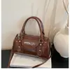 2026 Novo Estilo Simples e Fashionable Bolsa de Ombro Transversal para o Dia a Dia Estilo Coreano Couro com Óleo de Cera Bolsa Cilíndrica de Mão de Alto Valor para Mulheres