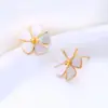 Novos brincos de concha de pérola com moinho de vento de flor de ameixa, moda de comércio exterior e-commerce transfronteiriço Amazon atacado de fábrica