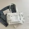 Bolso de lona de color liso transfronterizo nuevo, bolso de hombro de gran capacidad, bolso tote versátil para estudiantes, bolso de mano, bolso cruzado