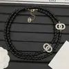 Versão de Luxo da Nova Corrente de Suéter Chanel Pérola Negra Resina Duplo C para Mulheres, Réplica de Luxo com Etiqueta