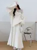 Conjunto de punto suave estilo francés 2026 otoño e invierno nuevo conjunto de dos piezas de suéter con flores tridimensionales + falda larga para mujer