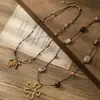 2026 Collar Retro de Cuerda Tejida a Mano con Cuentas de Acero de Titanio para Mujer Diseño de Nicho Estilo Étnico Cadena para Suéter Accesorios de Flor