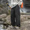 Pantalones casuales nuevos para hombre para trabajo al aire libre, resistentes al agua, con diseño dividido, pantalones largos y cierre ajustable de cuatro botones.