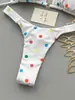 Bikini de lunares blancos de dos piezas para mujer, nuevo estilo verano 2026, cuello halter con lazo, copa triangular, traje de baño sexy reductor