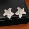 Pendientes de Estrella de Cinco Puntas con Lazo Tachonados de Zirconia y Perlas Plateadas, Pendientes Súper Brillantes y Exquisitos, Pendientes de Lujo Ligero y Alta Gama al por Mayor