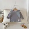 Novas Camisetas de Manga Longa para Meninos e Meninas da Primavera e Outono Cor Sólida Orelhas de Desenho Animado Pulôver para Bebês e Crianças Pequenas Roupa de Baixo Cor Sólida
