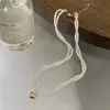 Collar con colgante de perla de imitación de doble capa, chapado en oro auténtico, con diseño de estrella de Internet, simple y elegante.