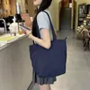 Estética de estilo japonês e estilo ocidental Personalizado Casual Ombro Pano Bolsa Bolsa de Classe de Estudante Feminina Nicho Commuter Tote Big Bag