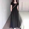 2026 Nuevo Estilo de Verano Estilo Hepburn Francés Vestido Negro para Vacaciones en la Costa, Adelgazante de Cintura, Manga Corta, Corte A, Vestido Largo