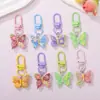 Llavero de resina con forma de mariposa de colores pastel, estilo lindo y dulce, colgante femenino, suministro para puestos callejeros y mercados nocturnos, accesorios de alta calidad al por mayor